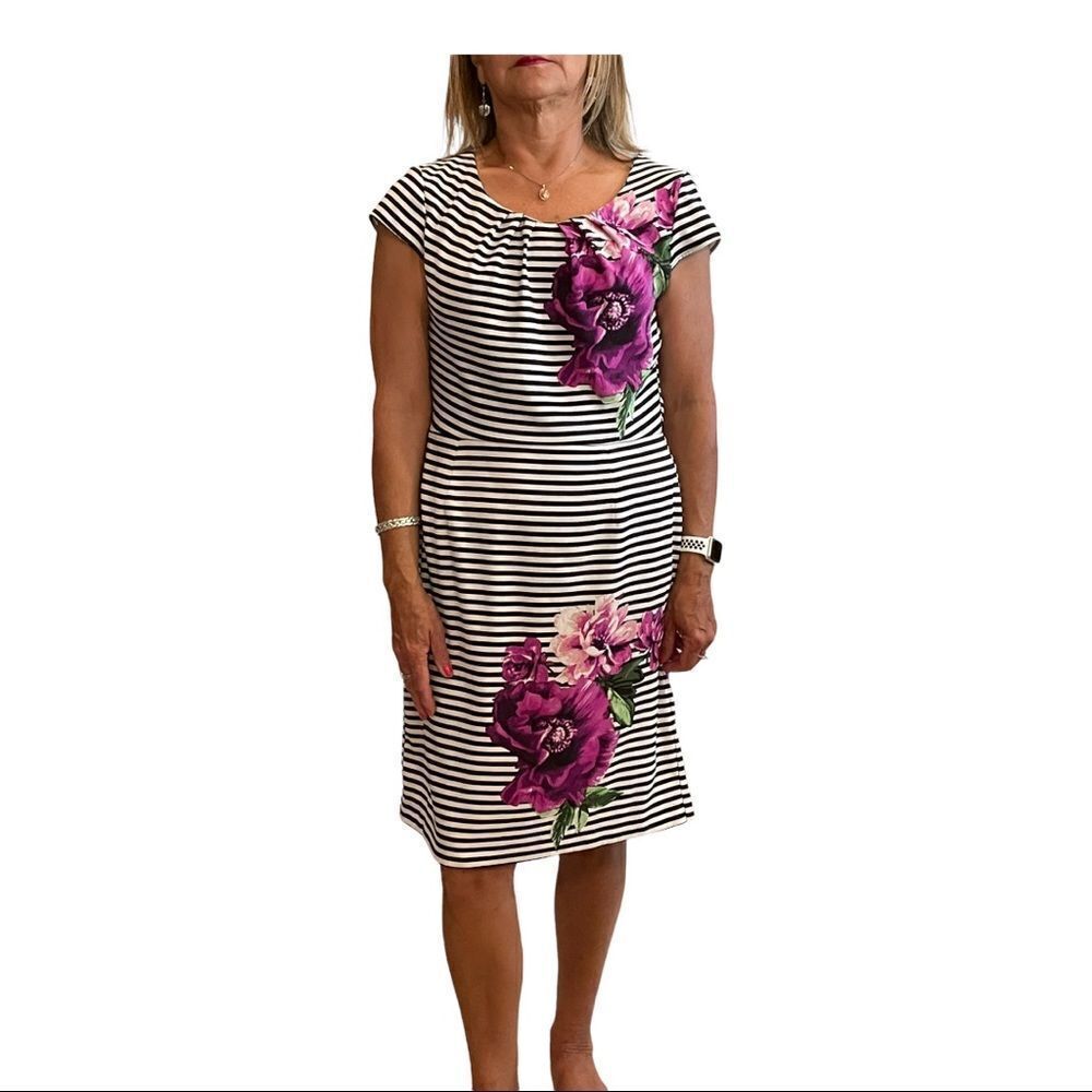 Black‎ and white striped dress with purple flowers.